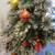 Christmas tree in decorative pot, with lights and ornaments 6 thumbnail