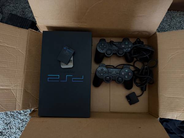 PlayStation 2 bundle with two controllers and two memory cards typical 1