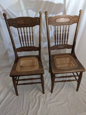 Antique pair of spindle chairs with carved back 1