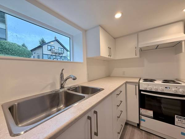 Central & Affordable 1 Bed + Den, 1 Bath Lower Suite (Quadra Village) 1