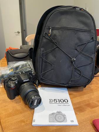 Nikon D5100 Digital Camera with bag and books 1