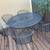 Wrought iron patio table and six stackable chairs with matching bench 1 thumbnail