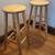Two - 29” high - natural wood backless bar stools. 1 thumbnail