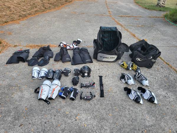 Hockey equipment padding bag skates sticks 1