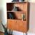 Vintage MCM teak shelf unit on hairpin legs, made in Denmark. 1 thumbnail