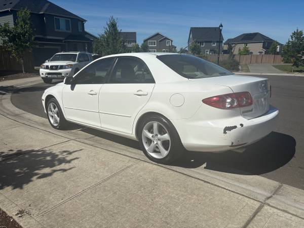 2005 Mazda 6 sedán de 4 puertas, pocos kilómetros 115k, todo original limpio, título - $2,900 (Tacoma)63654705474947122