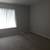 Soft hued paint accented with white paneled doors, Carports available 6 thumbnail