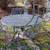 Outdoor metal table and 4 chairs very nice heavy , built solid 1 thumbnail