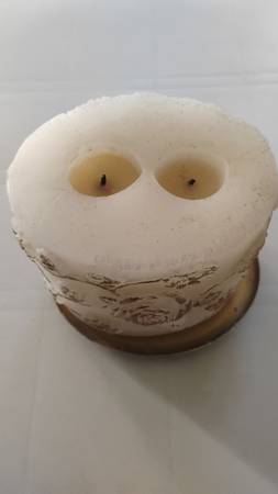Large white two-wick decorative candle with gold colored metal base 1