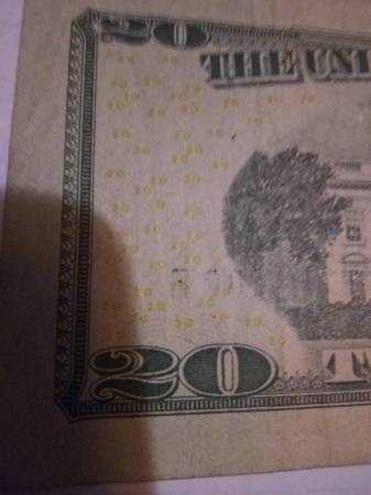 $20, notes with serial numbers showing through on the reverse 1