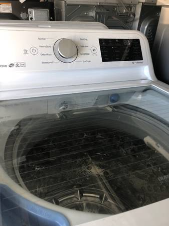 LG top load washer and electric dryer 1