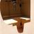 small brass sink mounted in a half moon vanity with black stone top 7 thumbnail