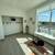 Large windows with shade coverings, Stainless steel appliances 2 thumbnail