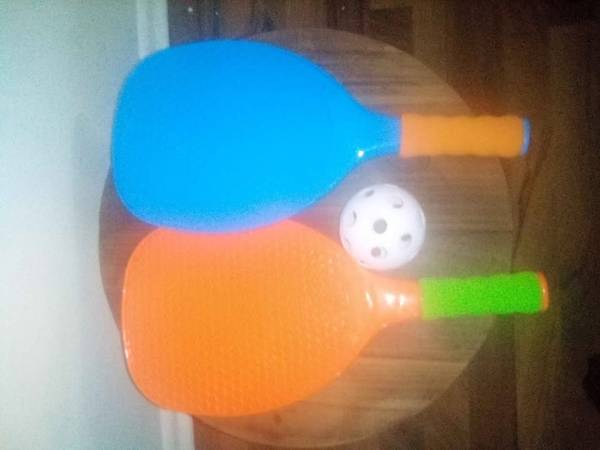 2 Pickleball raquets and ball 1