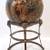 Large ceramic 7.5" sphere on brass stand with 4 ram's head motifs 1 thumbnail