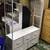 White hanger rack with integrated drawers and wheels. 4 thumbnail