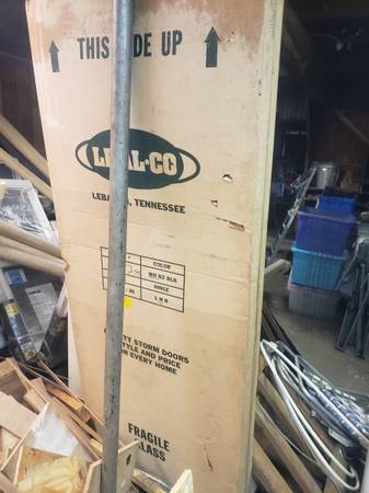 2  32" storm doors--new 1