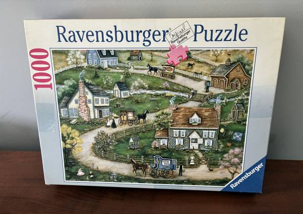 1000pc Ravensburger Puzzle "Delivery Day in Hidden Valley" 1