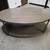 Gray Rustic Oval Coffee Table on Wheels 2 thumbnail