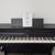 Roland HP704 Digital Upright Piano With Bench Charcoal Black 1 thumbnail