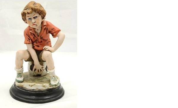 8" Angry Boy on soccer ball ceramic figurine 1
