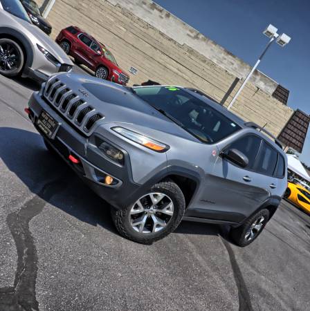 Grey 2016 Jeep Cherokee Trailhawk SUV with 174k miles. 1