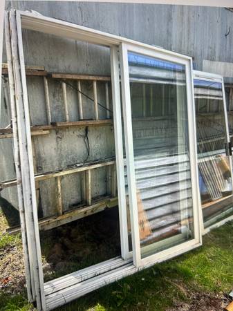 Two vinyl 6 ft sliders. $100 ea obo 1