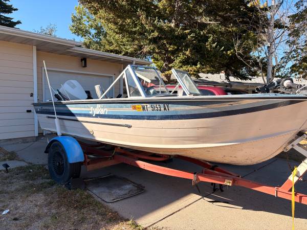 14 ft boat and trailer w/ multiple motors 1