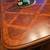 84 " Basset dining room table. With 4 chairs 1 thumbnail