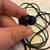 Black in-ear headphones 2 thumbnail
