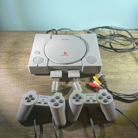 PlayStation 1 with two controllers and AV cable 1