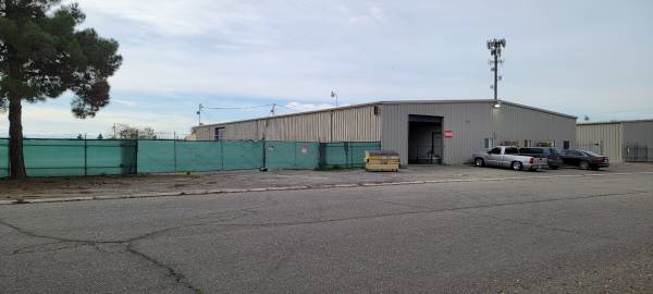 Light industrial building with 11,200 sq feet shop and almost one Acre 1