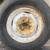 One classic 15 inch steel rim with an old tire 5 on 4.5 1 thumbnail