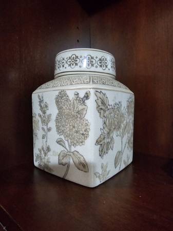 Decorative ceramic jar with floral design. 1