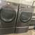 Grey LG  Thin Q Front Load Washer and Dryer on Pedestals 1 thumbnail