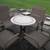 OUTDOOR TABLE WITH STONE TOP, AND 4 CHAIRS - 2 SWIVEL 1 thumbnail
