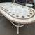 WROUGHT IRON AND TRAVERTINE STONE OUTDOOR TABLE 1 thumbnail