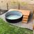 Stock tank pool + custom deck + wood-fire heater 1 thumbnail