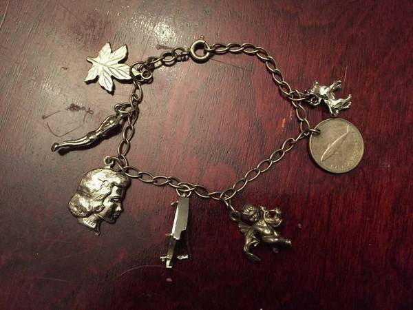 Vintage Sterling Silver Bracelet with Unique and Vintage Charms 1