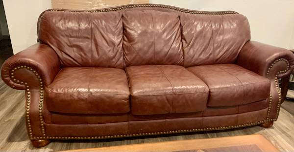 2 brown leather couches 1