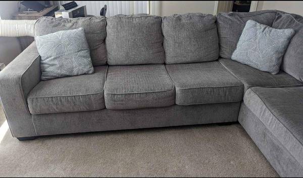 Sectional couch with pillows 1