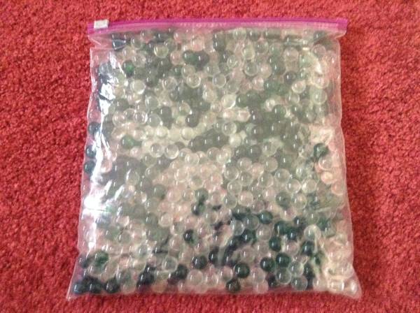 Dark Green and Clear Round Marbles 1