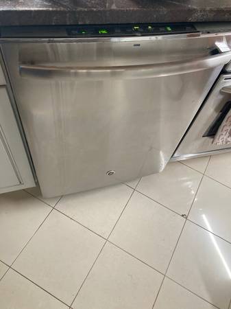 GE General Electric Adora stainless steel dishwasher. Works but needs 1