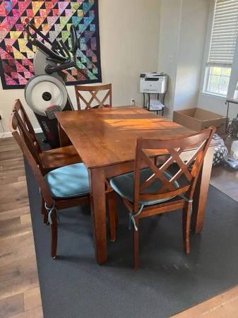 Solid wood dining table (with leaf) and four chairs 1