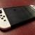 Perfect condition white OLED Switch w/ carrying case & silicone grips 1 thumbnail