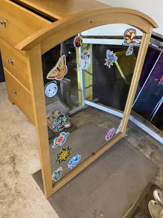 Solid wood framed mirror, nice and sturdy. 1