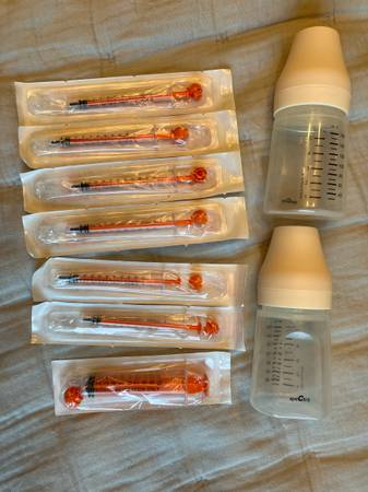 Two spectra compatable bottles and some colostrum syringes 1