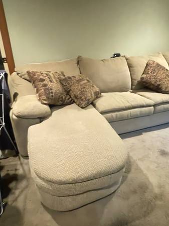 Sectional upholstered with hide a bed. 1