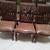 round wooden dining table, 6 chairs, chest freezer, plants 1 thumbnail