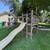 Outdoor Wooden Play set with slide, two swings, trapeze bar, and climb 4 thumbnail